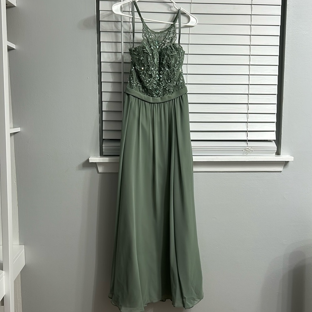 Sage green Kennedy Blue bridesmaid dress.